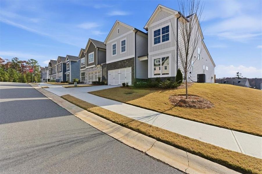 Front exterior of a new home in Lakeside at Great Sky, Canton, GA, highlighting curb appeal (Image 23).