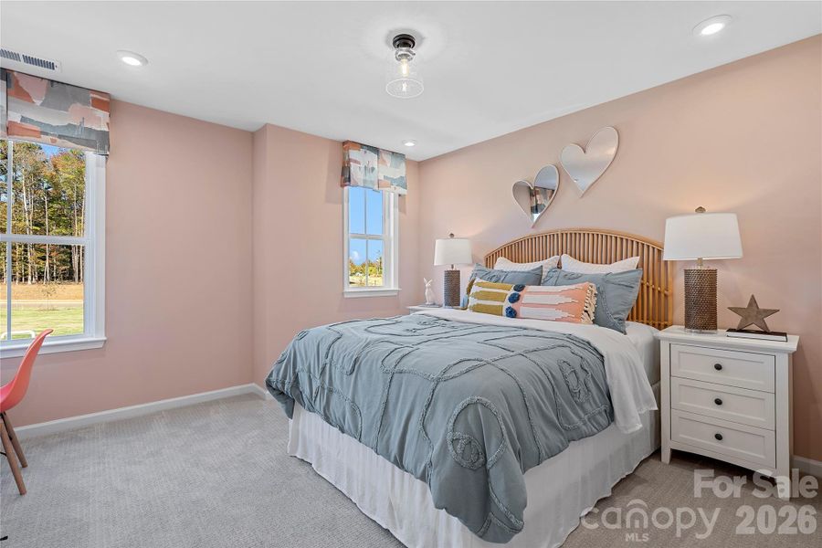Secondary Bedroom filled with natural light. Secondary Bedroom filled with natural light.