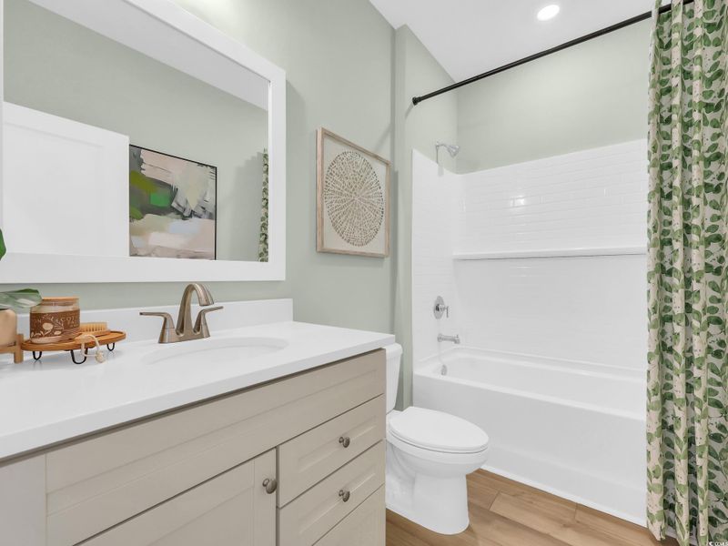 Carpeted bedroom with baseboards and recessed lighting