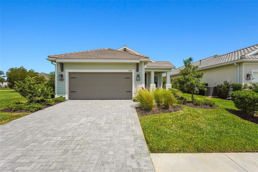 Front exterior of a new home in , Sarasota, FL, highlighting curb appeal (Image 27).