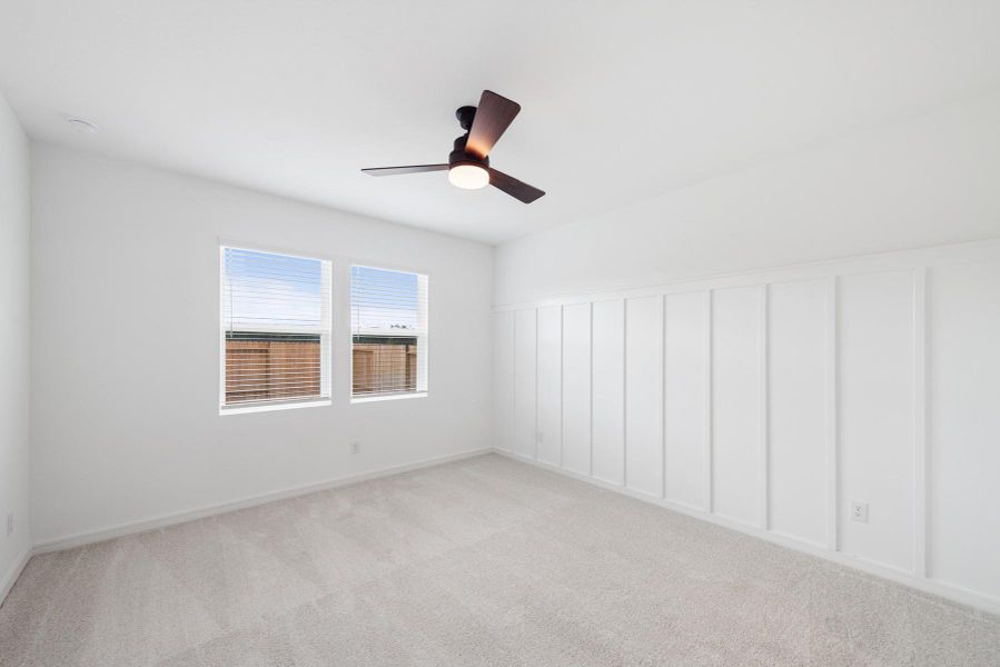 Spacious primary suite with feature wall Spacious primary suite with feature wall