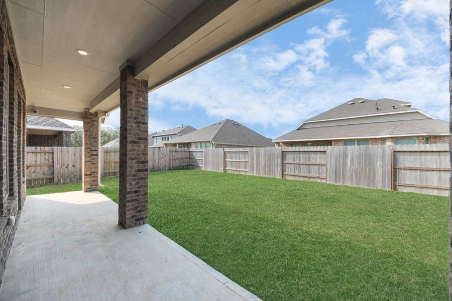 Exterior details and patio area of a home in Tavola: Fairway Collection, New Caney (Image 4).