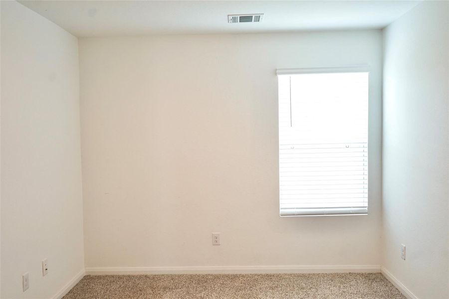 Primary bedroom with ensuite restroom