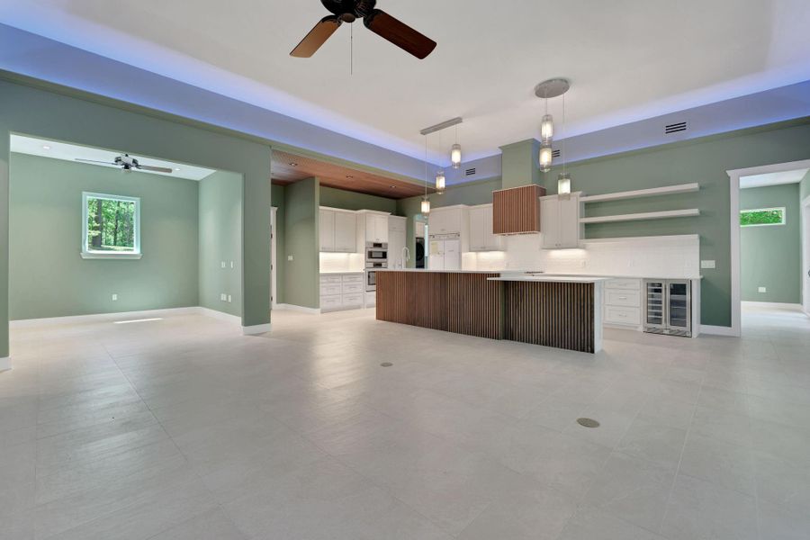Spacious open floor plan. The kitchen has a large center island with wood accent.