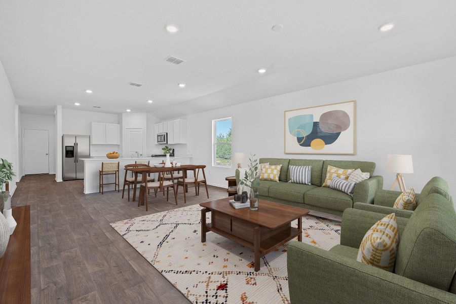 Living area with recessed lighting and dark wood finished floors Living area with recessed lighting and dark wood finished floors