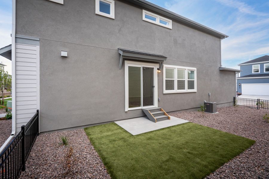 Exterior details and patio area of a home in Revel Crossing at Wolf Ranch – The Ascent Collection, Colorado Springs (Image 3).