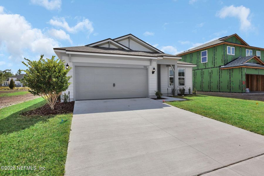 Front exterior of a new home in Hyland Trail, Green Cove Springs, FL, highlighting curb appeal (Image 1). Front exterior of a new home in Hyland Trail, Green Cove Springs, FL, highlighting curb appeal (Image 1).