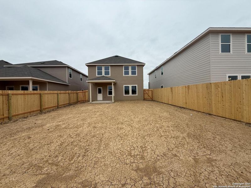 Exterior details and patio area of a home in Meadows at Hennersby Hollow 40's, San Antonio (Image 18).