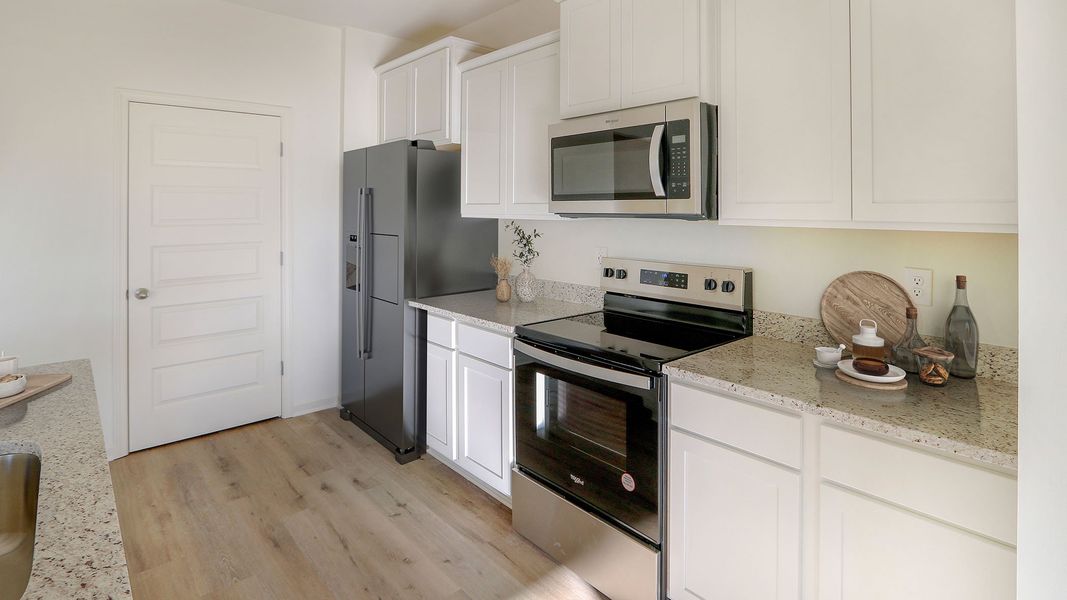 Furnished interior view inside a new home in Magnolia at the Bluffs Phase 3, Freeport (Image 9). Furnished interior view inside a new home in Magnolia at the Bluffs Phase 3, Freeport (Image 9).