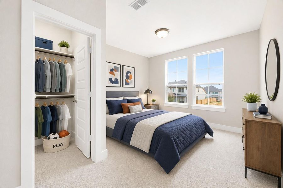 This secondary bedroom includes a spacious walk-in closet with built-in shelving, along with two large windows for plenty of natural light. Virtually staged. This secondary bedroom includes a spacious walk-in closet with built-in shelving, along with two large windows for plenty of natural light. Virtually staged.