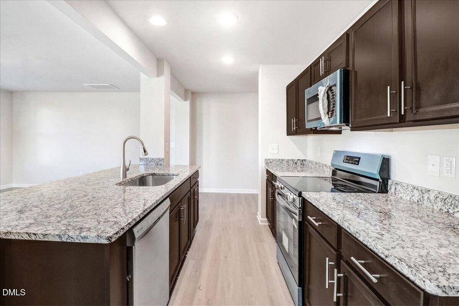 26-Kitchen view toward living area in ne