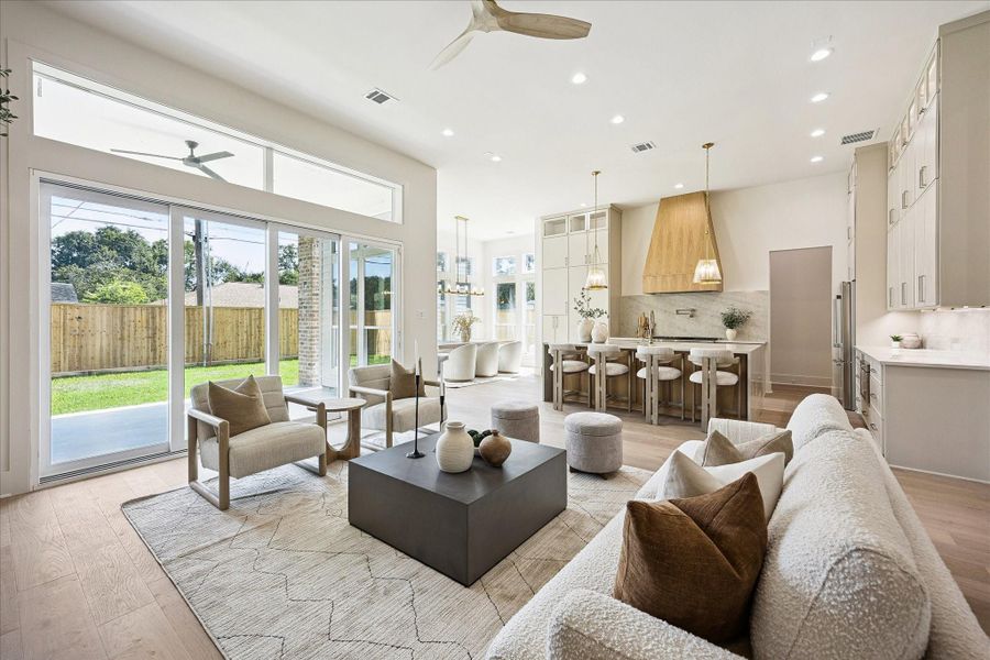 From casual mornings to a house full of guests, this expansive living area is ready for it all with a seamless connection to the kitchen, custom white oak details and recessed lighting throughout. Premium Amsco Low-E double-pane windows bring in beautiful natural light, while an expansive multi-panel glass door folds and stacks neatly to one side for effortless indoor-outdoor living.