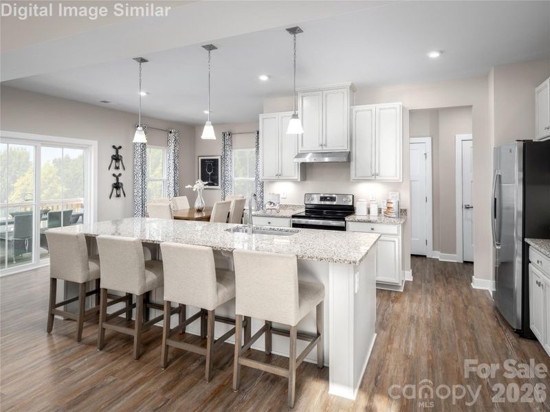 Open and inviting — seating for four at the island makes this kitchen perfect for casual meals and conversation.