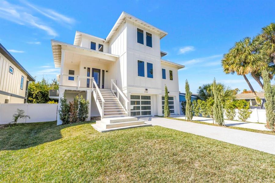 Front exterior of a new home in , St. Petersburg, FL, highlighting curb appeal (Image 29).