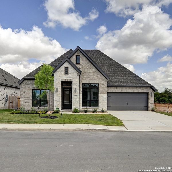 Front exterior of a new home in Alsatian Oaks 60', Castroville, TX, highlighting curb appeal (Image 17). Front exterior of a new home in Alsatian Oaks 60', Castroville, TX, highlighting curb appeal (Image 17).