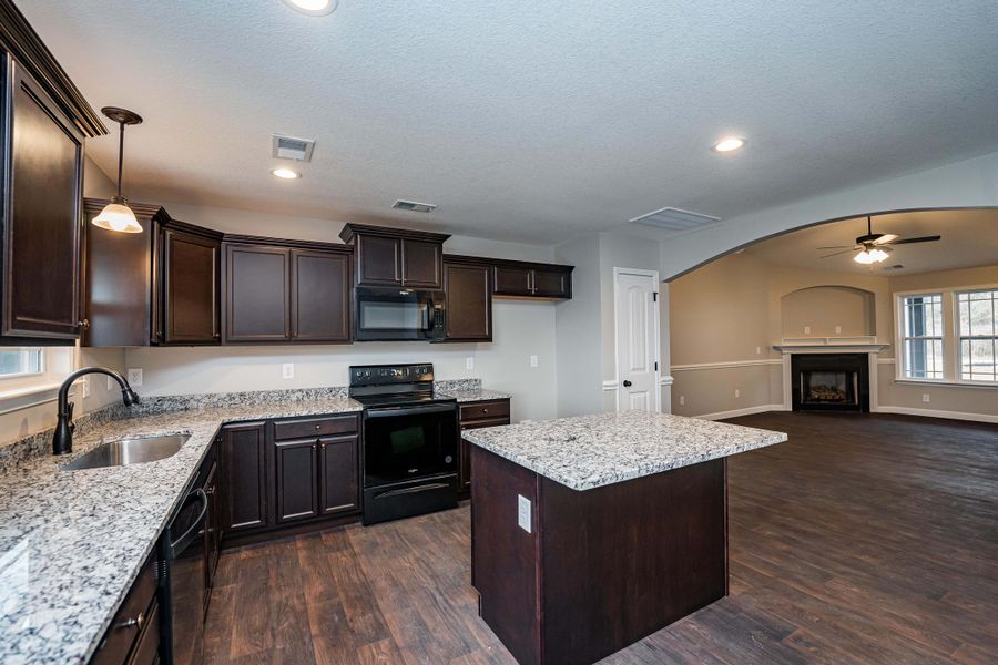 Representative furnished interior of a home built from the Saxon by Enchanted Homes in Guadalupe Heights, Seguin (Image 13).