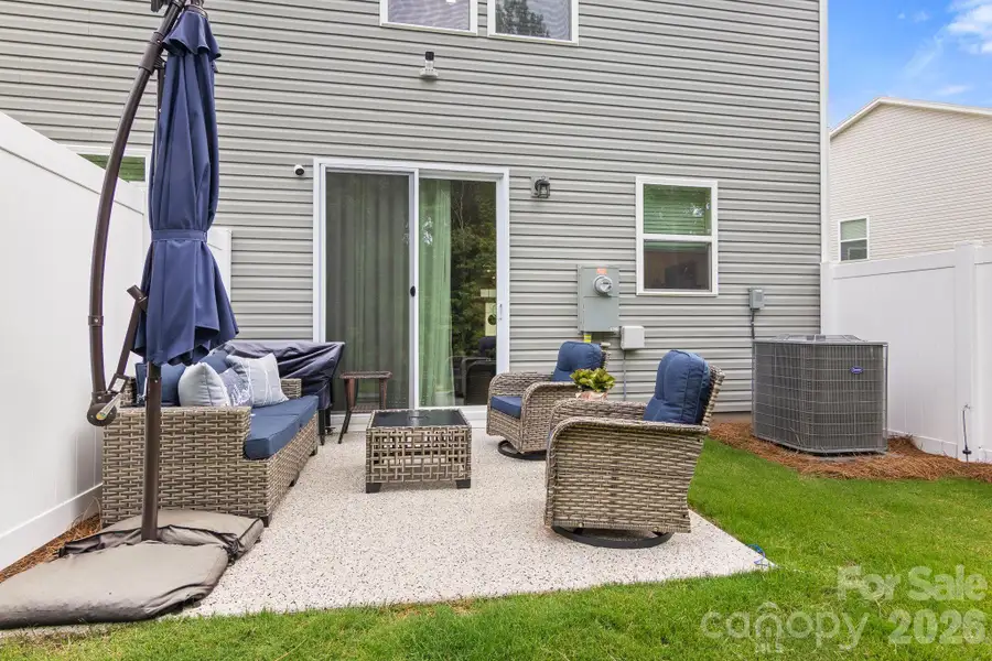 Exterior details and patio area of a home in Hedgecliff Townes, Concord (Image 24). Exterior details and patio area of a home in Hedgecliff Townes, Concord (Image 24).