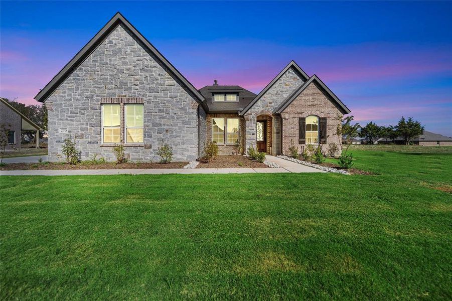 Front exterior of a new home in Fannin Ranch, Leonard, TX, highlighting curb appeal (Image 1). Front exterior of a new home in Fannin Ranch, Leonard, TX, highlighting curb appeal (Image 1).