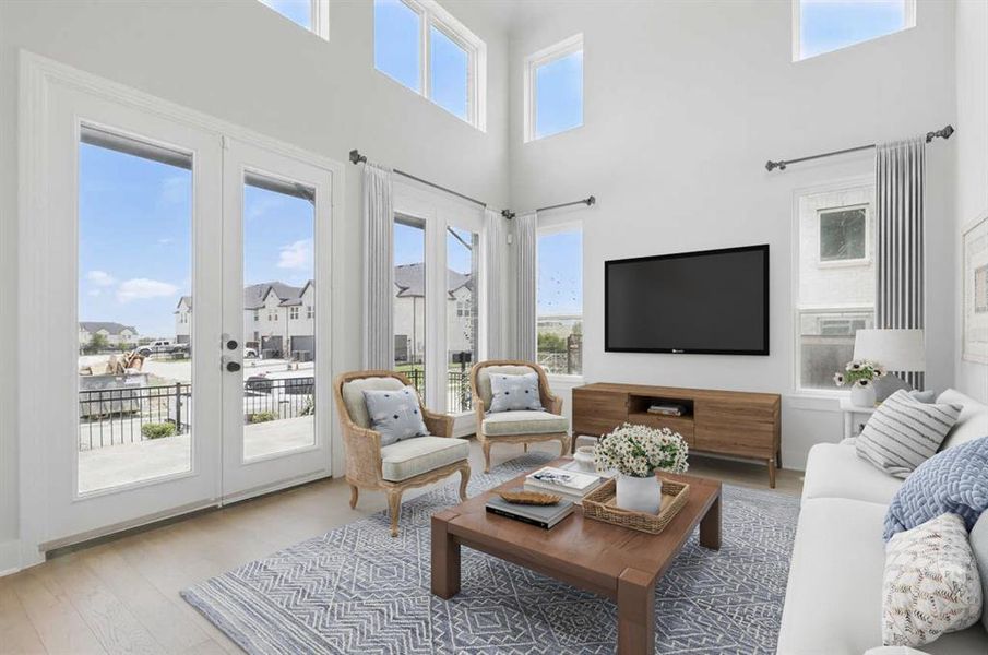 Sunroom / solarium featuring french doors