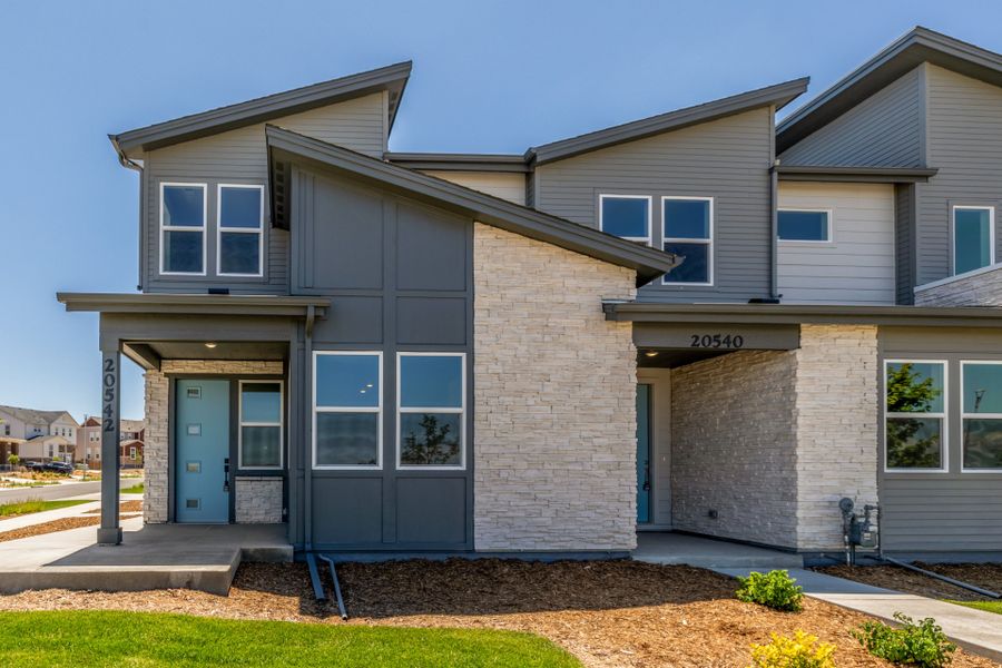 Front exterior of a new home in Painted Prairie, Aurora, CO, highlighting curb appeal (Image 2).