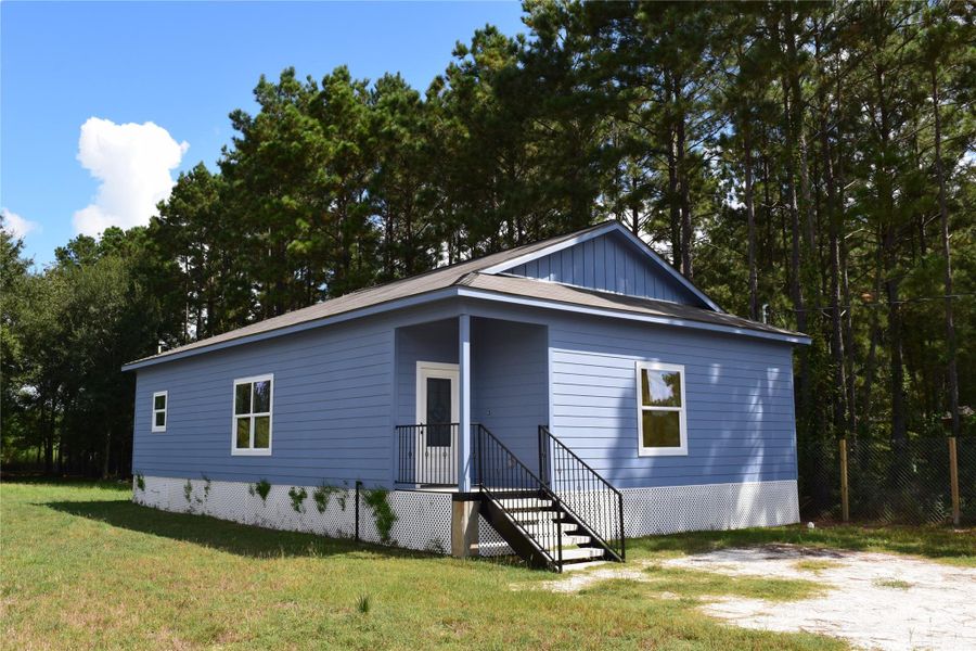 Front exterior of a new home in , Cleveland, TX, highlighting curb appeal (Image 17).