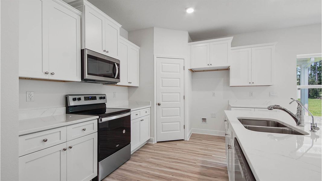Representative furnished interior of a home built from the Kennedy by D.R. Horton in Bayside at Ward Creek, Panama City Beach (Image 6).