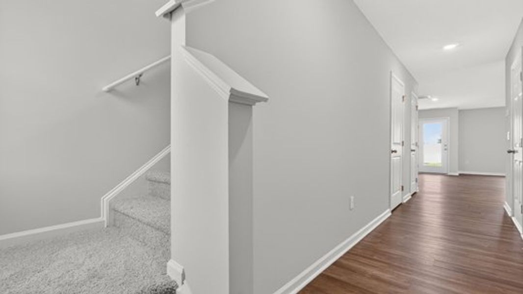 Spacious, unfurnished interior of a new home in The Townes at Belle Grove, Wendell (Image 9).