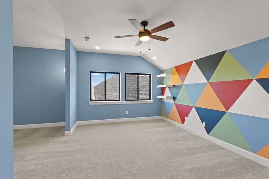 Spacious game room with colorful custom mural