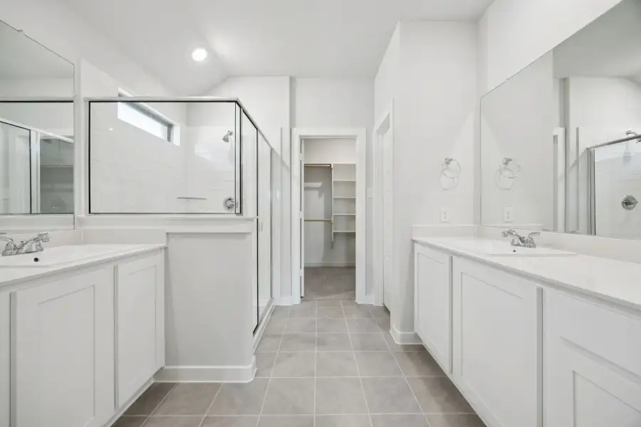 Primary Bathroom in the Heisman home plan by Trophy Signature Homes – REPRESENTATIVE PHOTO