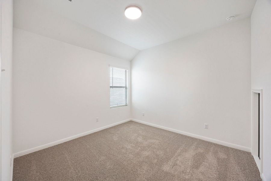 Bedroom in the Magnolia home plan by Trophy Signature Homes – REPRESENTATIVE PHOTO