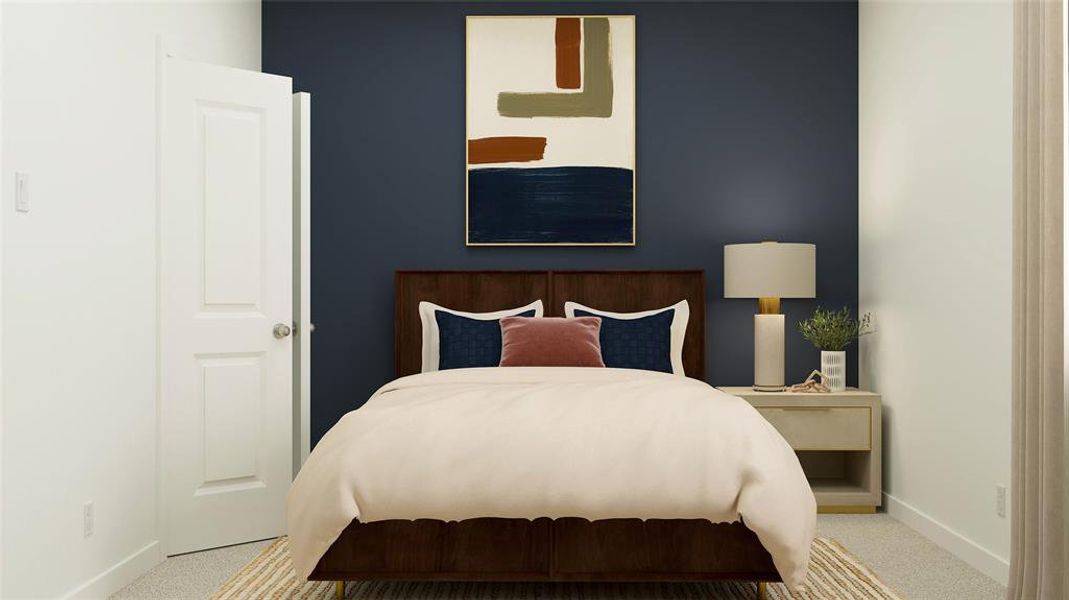 Bedroom featuring light carpet and baseboards