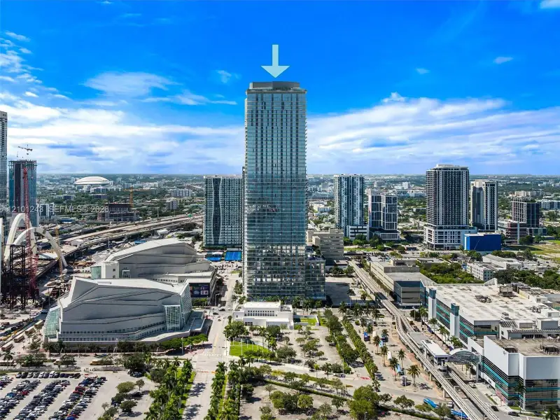 High-rise tower featuring a glass facade, expansive floor-to-ceiling windows, and private balconies High-rise tower featuring a glass facade, expansive floor-to-ceiling windows, and private balconies