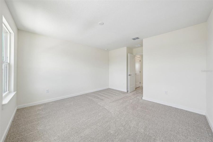 Spacious, unfurnished interior of a new home in Grasslands West, Lakeland (Image 39).