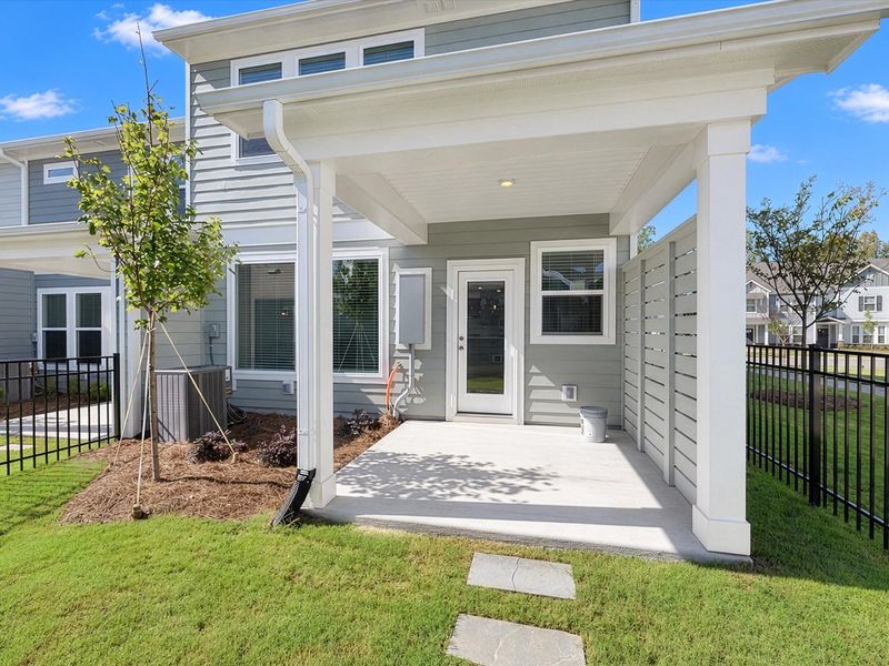 Exterior details and patio area of a home in North Creek Village - Townhomes, Huntersville (Image 20).