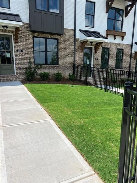 View of exterior entry with brick siding