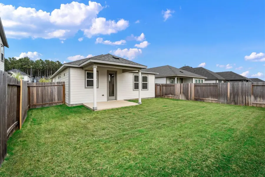 Exterior details and patio area of a home in Mason Woods, Cypress (Image 4).