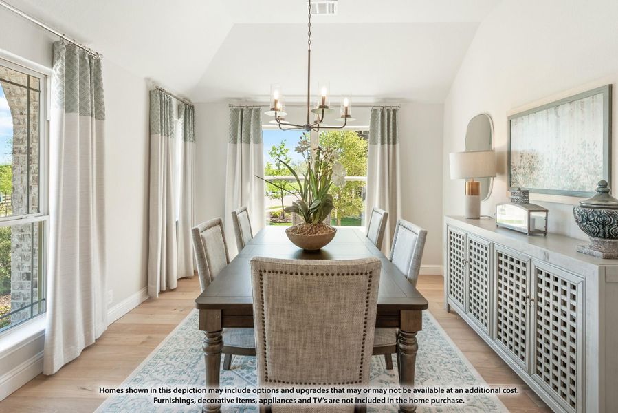 Formal dining room with dark wood table, six upholstered chairs, chandelier, and vaulted ceiling with hardwood floors Formal dining room with dark wood table, six upholstered chairs, chandelier, and vaulted ceiling with hardwood floors