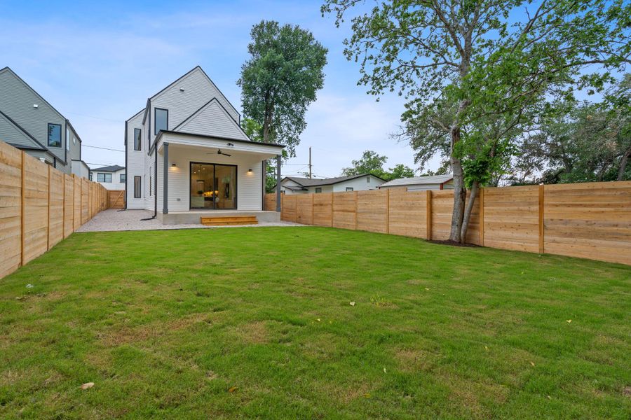 Rear view of property featuring a patio area, a fenced backyard, and a ceiling fan Rear view of property featuring a patio area, a fenced backyard, and a ceiling fan