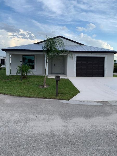 Front exterior of a new home in , Fort Pierce, FL, highlighting curb appeal (Image 15).
