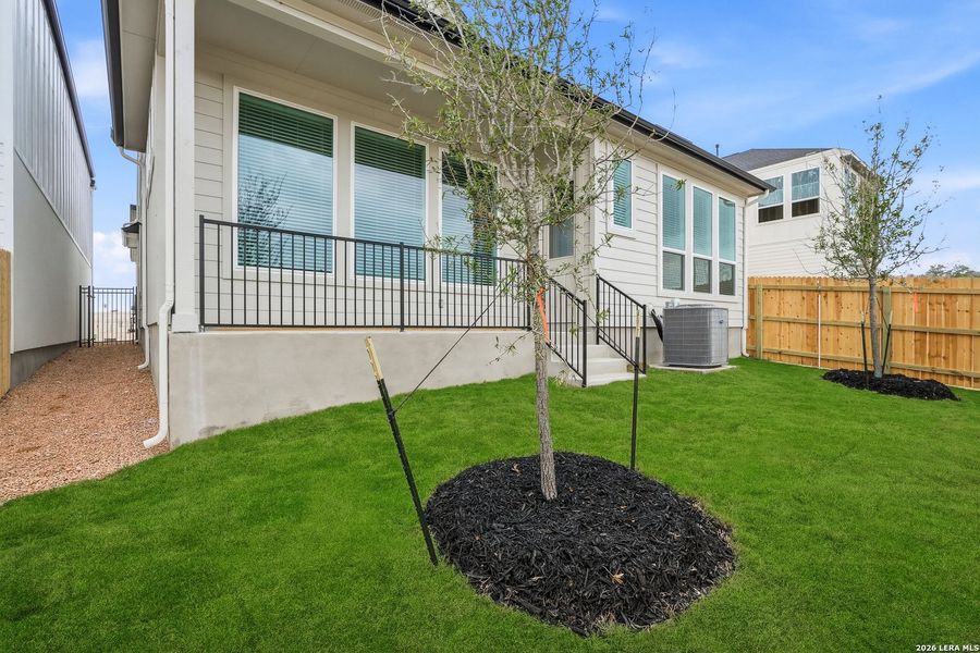 Exterior details and patio area of a home in Prominence, San Antonio (Image 25).