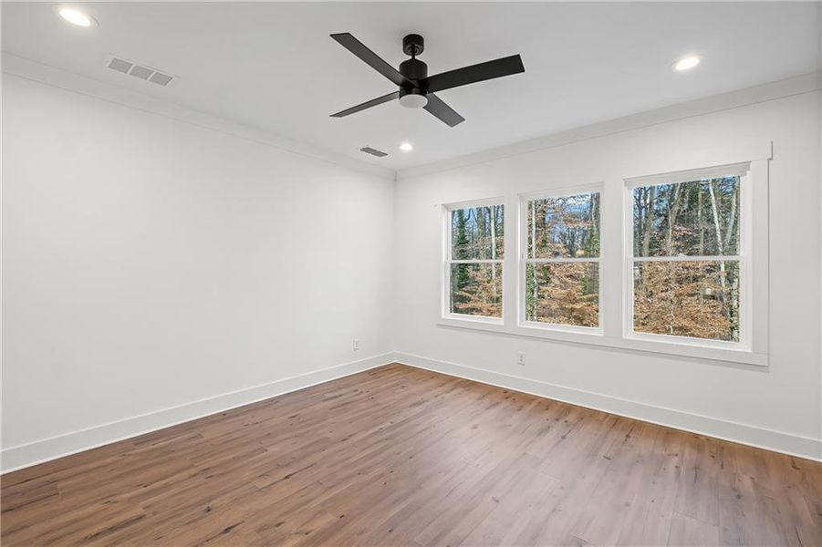 Spacious, unfurnished interior of a new home in Devin's Shire - A Kennesaw Tradition, Kennesaw (Image 17).