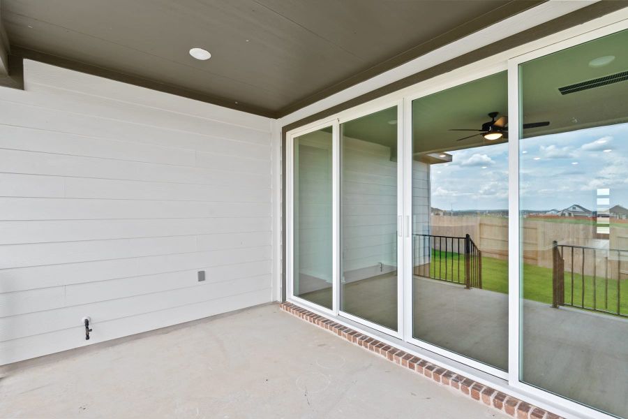 Exterior details and patio area of a home in Lariat, Liberty Hill (Image 24).