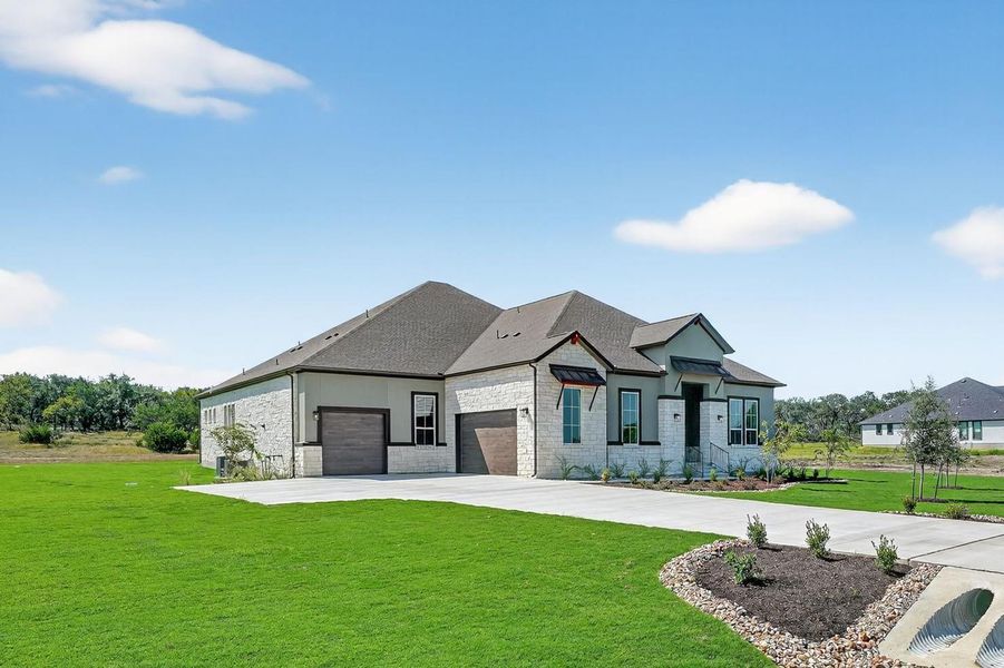 View of front of home featuring a front lawn, driveway, a garage, stone siding, and a shingled roof View of front of home featuring a front lawn, driveway, a garage, stone siding, and a shingled roof