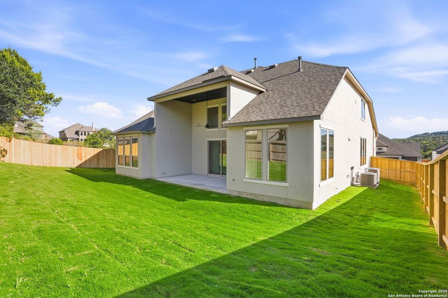 Exterior details and patio area of a home in Kinder Ranch 70's, San Antonio (Image 29).