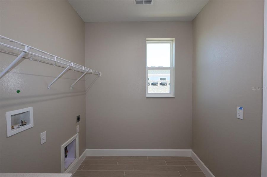 Spacious, unfurnished interior of a new home in Lake Star at Ovation, Winter Garden (Image 22).