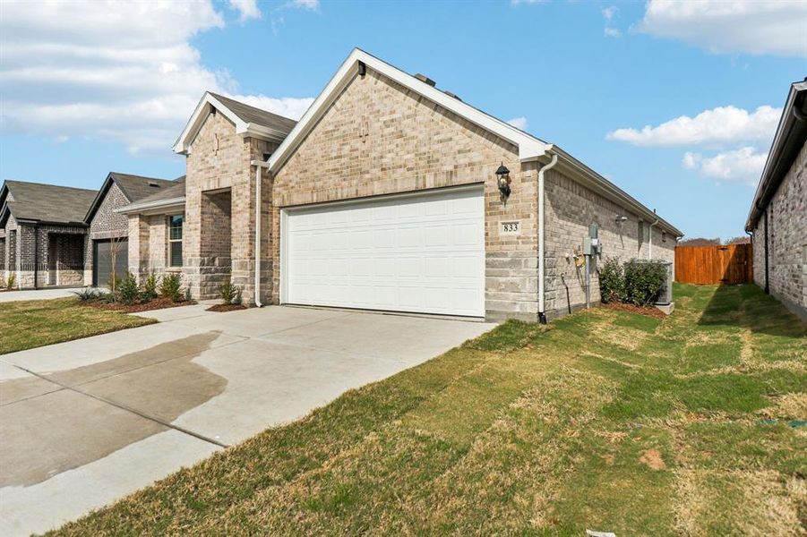 Front exterior of a new home in Trails of Lavon - Signature Series, Lavon, TX, highlighting curb appeal (Image 2). Front exterior of a new home in Trails of Lavon - Signature Series, Lavon, TX, highlighting curb appeal (Image 2).