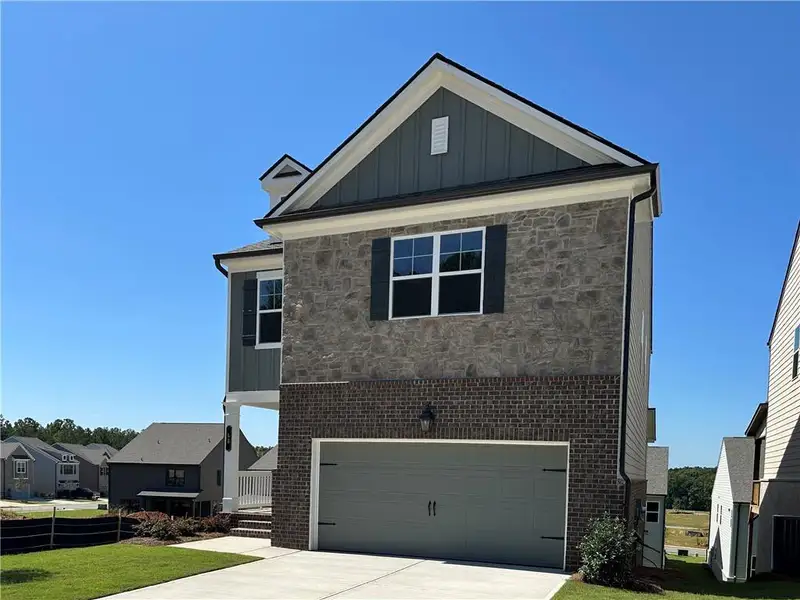 Front exterior of a new home in Kentmere, Auburn, GA, highlighting curb appeal (Image 2). Front exterior of a new home in Kentmere, Auburn, GA, highlighting curb appeal (Image 2).