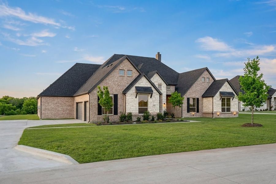 Front exterior of a new home in Berkshire Estates, Mesquite, TX, highlighting curb appeal (Image 2).