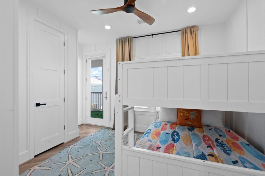 Waking up with options. From the comfort of the bunk bed, you’ll spot direct access to both the bathroom and the balcony—making mornings easy and evenings breezy. With soft light filtering through the blinds and a cozy coastal design, this space blends function and charm effortlessly. Waking up with options. From the comfort of the bunk bed, you’ll spot direct access to both the bathroom and the balcony—making mornings easy and evenings breezy. With soft light filtering through the blinds and a cozy coastal design, this space blends function and charm effortlessly.