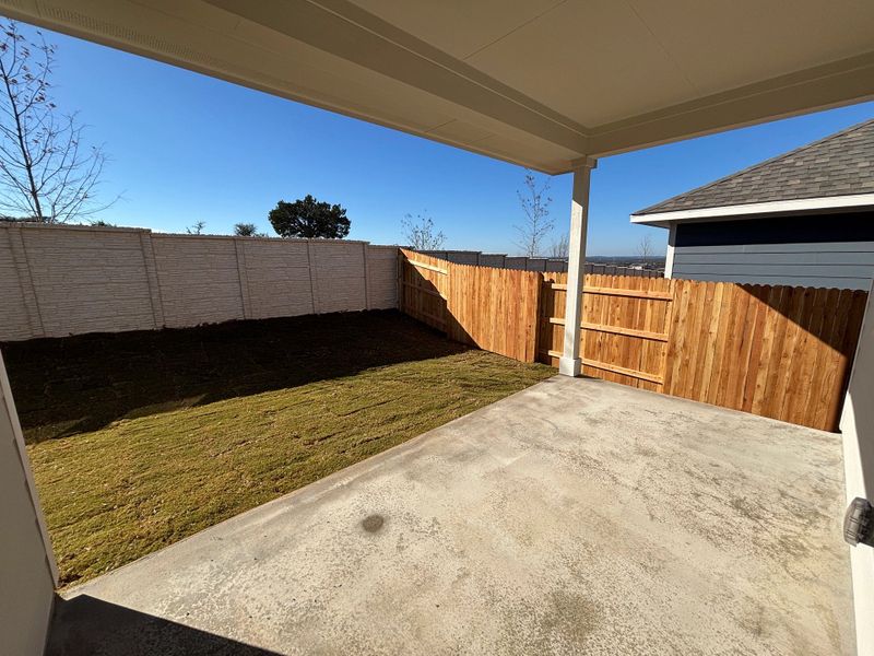 Exterior details and patio area of a home in Cannon Ranch 40s, Dripping Springs (Image 4).